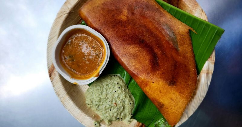 Traditional South Indian Masala Dosa on a banana leaf