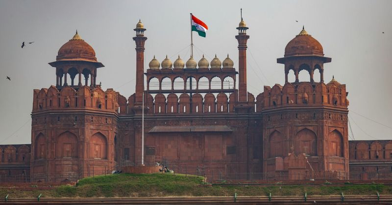 Red Fort's Lahori Gate in Old Delhi — the 17th-century Mughal fortress built by Emperor Shah Jahan in 1638 is the most recognisable symbol of Delhi; foreigners ₹550 entry, closed Mondays, best visited Tuesday–Sunday 9:30am–11am before the crowd peaks
