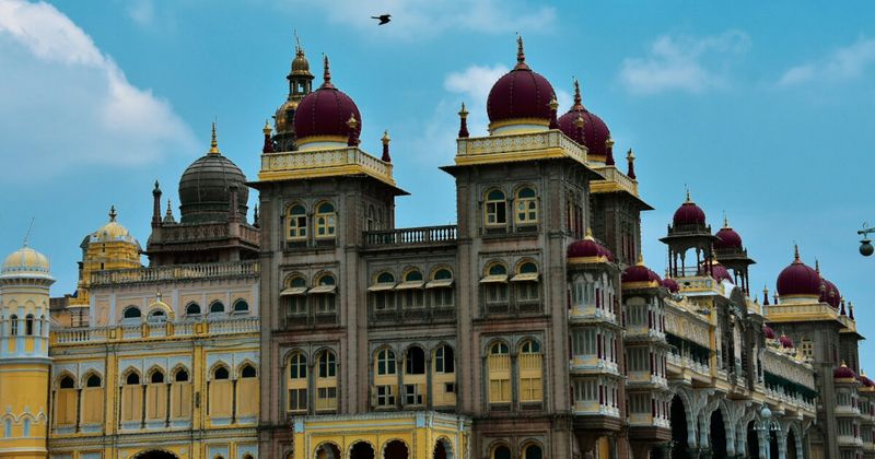 Ornate domes of Mysore Palace against deep blue sky Karnataka South India — one month India itinerary Week 3