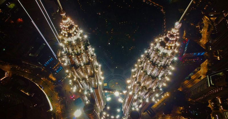 Kuala Lumpur Malaysia Petronas Towers — reachable from India on return flights from ₹18,000 visa-free until December 2026