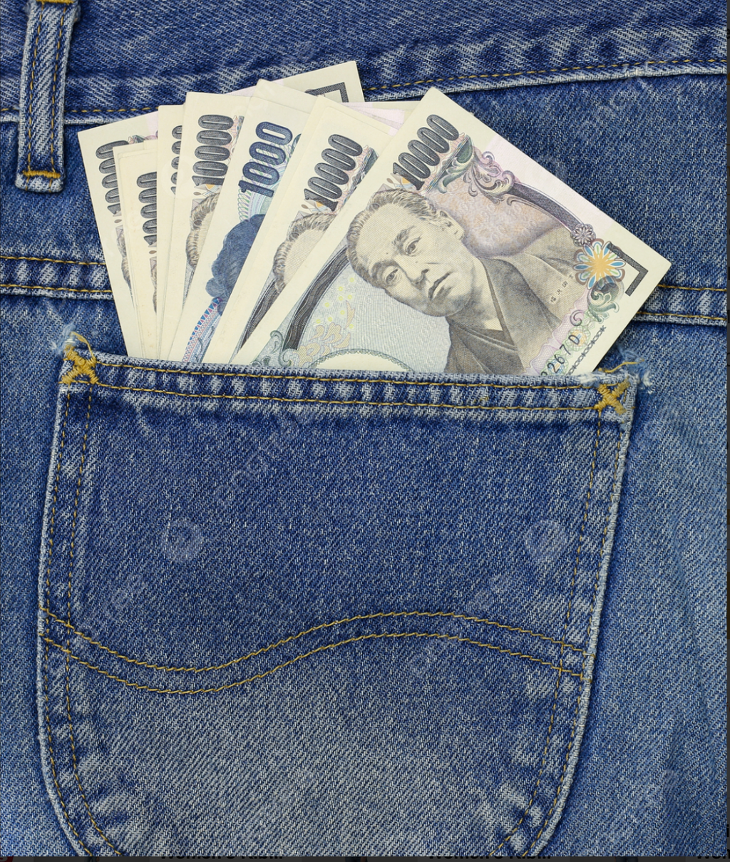 Japanese 10,000 yen banknotes tucked into the back pocket of blue denim jeans.