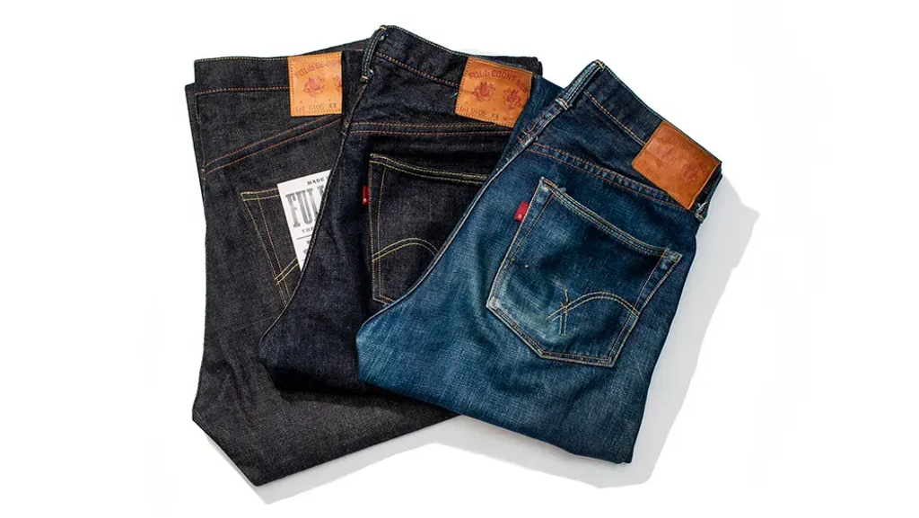 Three premium jeans in different washes with leather patches and distinctive stitching.