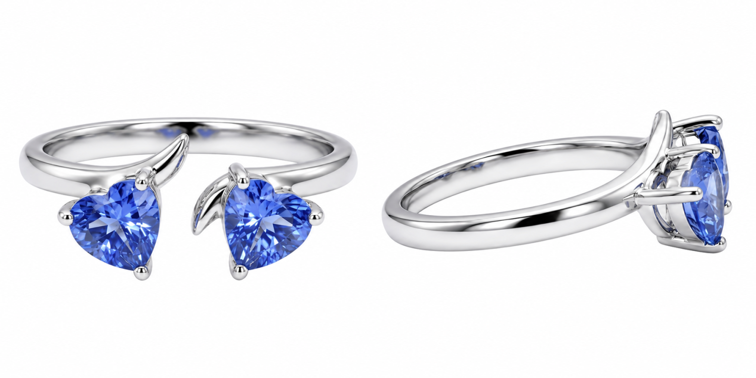 Two heart-cut blue sapphires facing one another in an open 18k gold ring