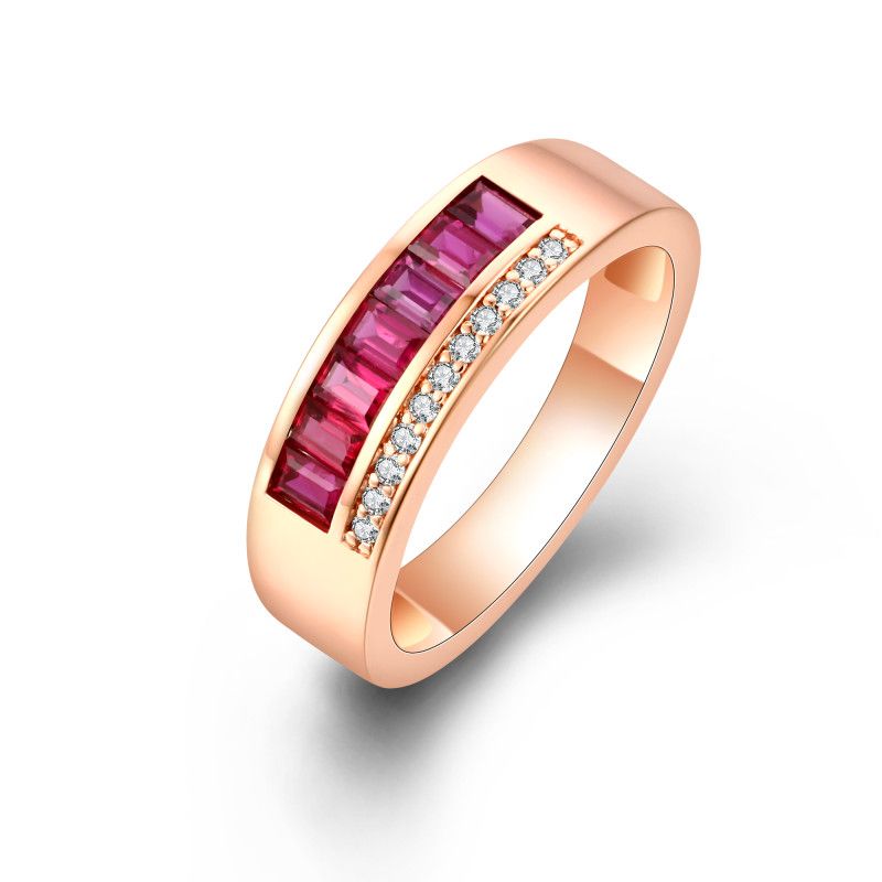 Channel-set baguette rubies beside a row of round natural diamonds in an 18k rose gold band ring