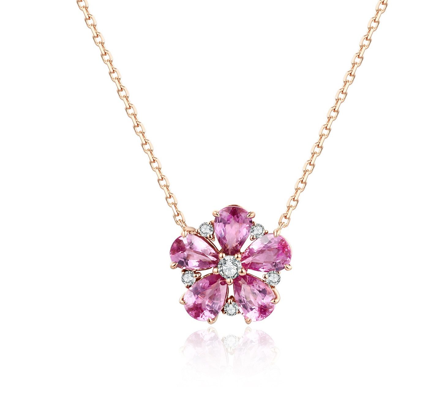 Pear-cut pink sapphire flower pendant with natural diamond accents in 18k rose gold