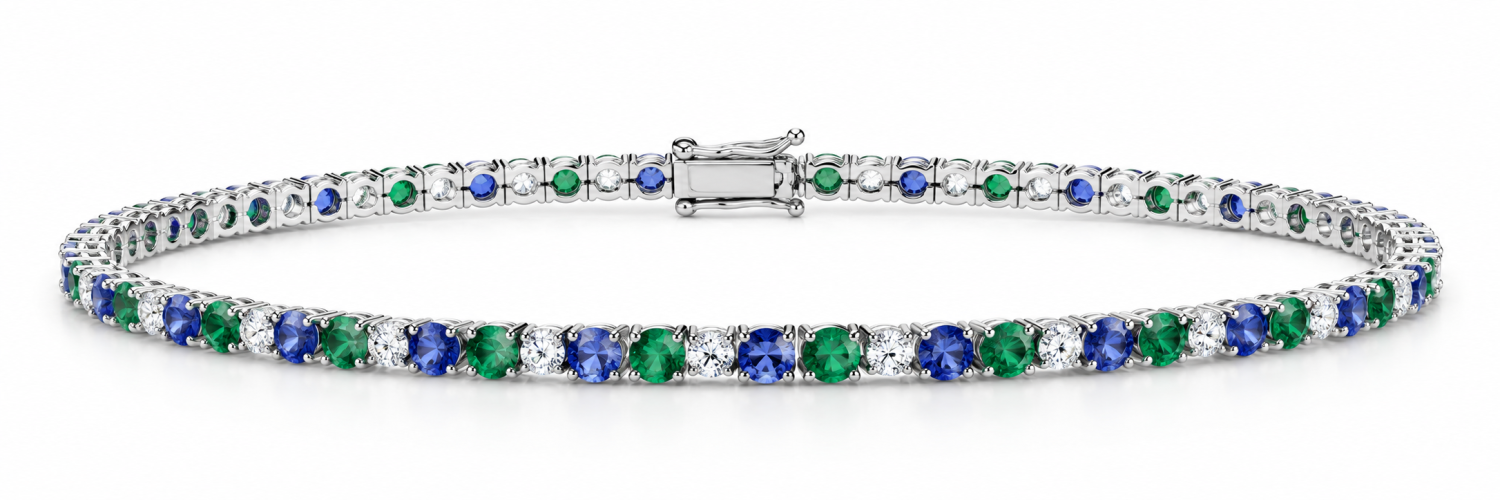 Oval tanzanite, emerald and natural diamond tennis bracelet in 18k white gold, shown clasped
