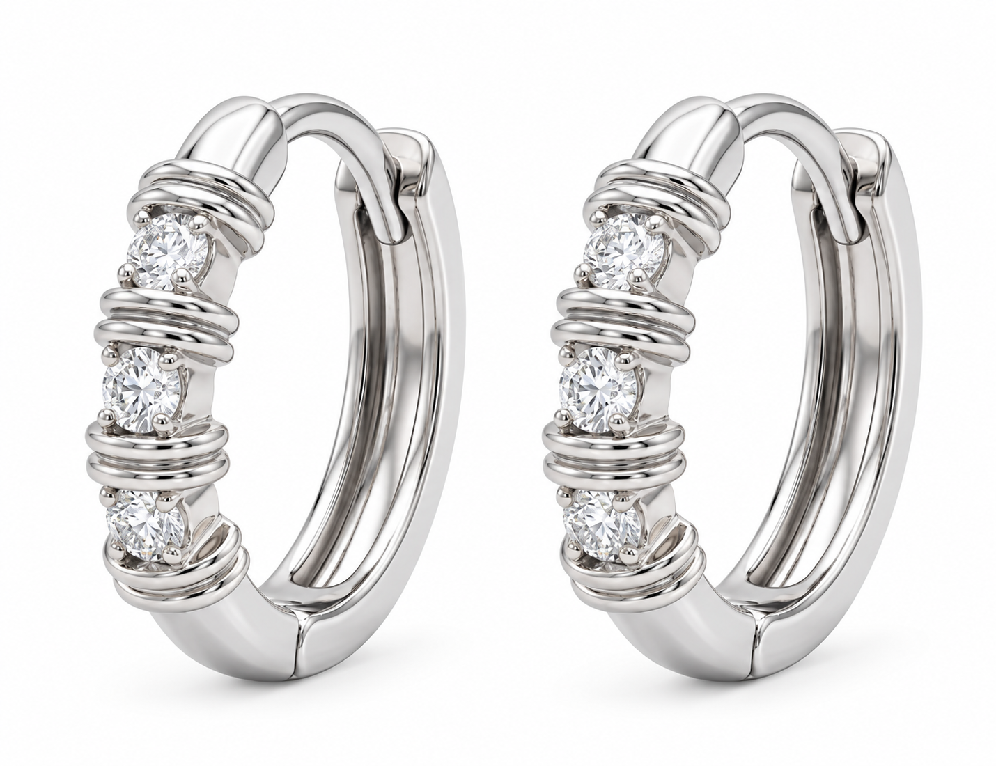 Pair of white-toned gold hoop earrings with round diamonds alternating with raised ribbed details
