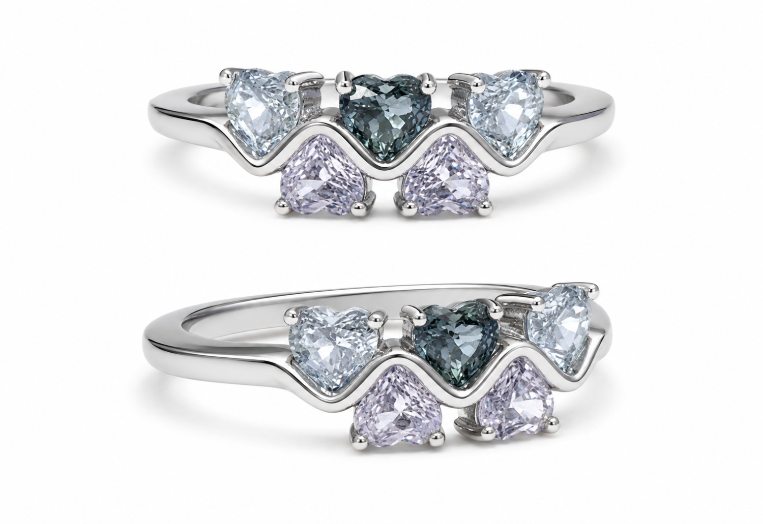 Five heart-cut sapphires arranged across a sculpted 18k gold ring