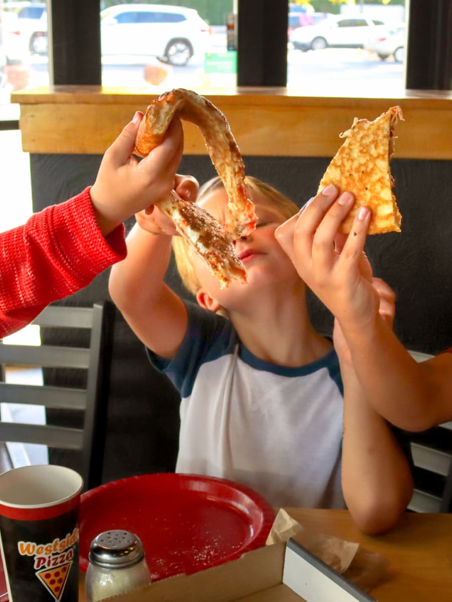 Three kids having fun at Westside Pizza