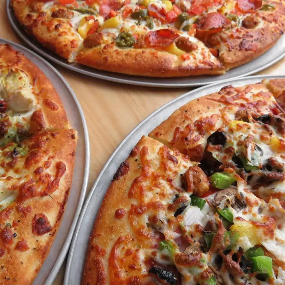 Three Pizzas from Westside Pizza on a Table | Westside Pizza