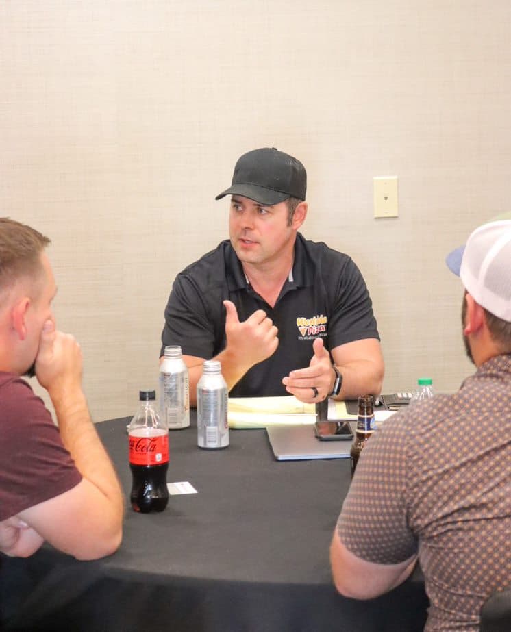 A person in a Westside Pizza uniform holding a meeting | Westside Pizza