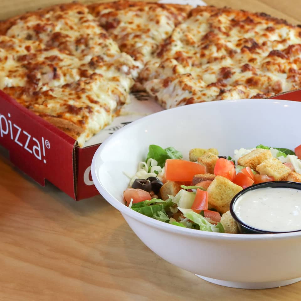 Westside Pizza in a Box Next to a Salad | Westside Pizza