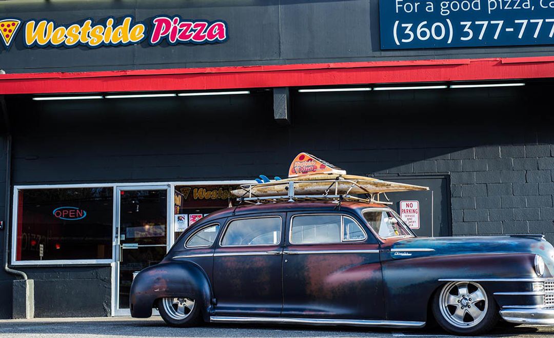 Exterior of Westside Pizza with a Vintage Car in Front | Westside Pizza