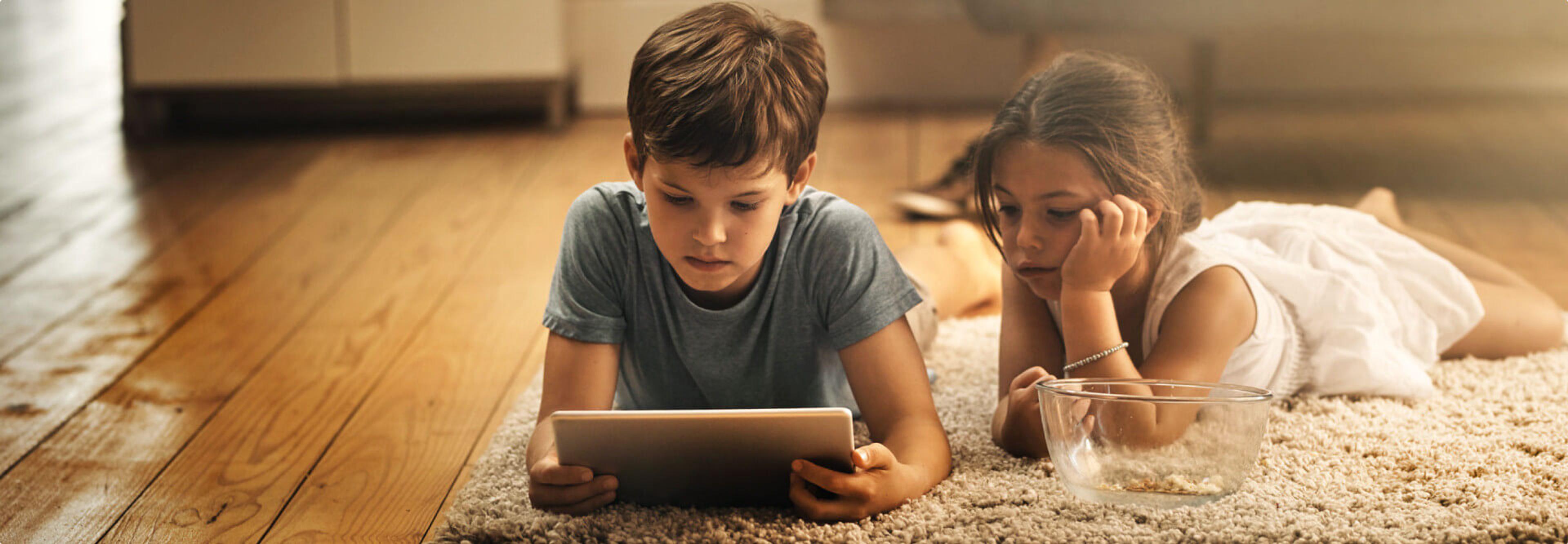 Children reading a book in the app