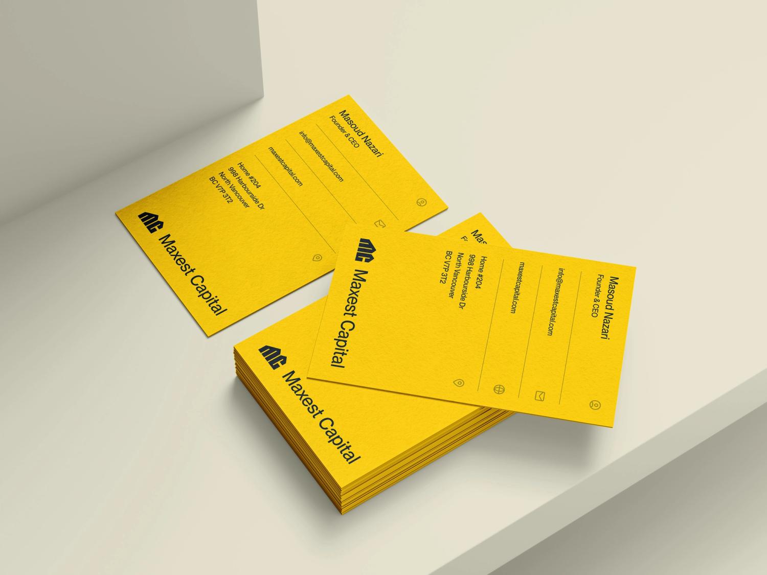 Maxest Capital business cards with bold yellow design and contact details for Masoud Nazari, Founder & CEO, showcasing modern branding.