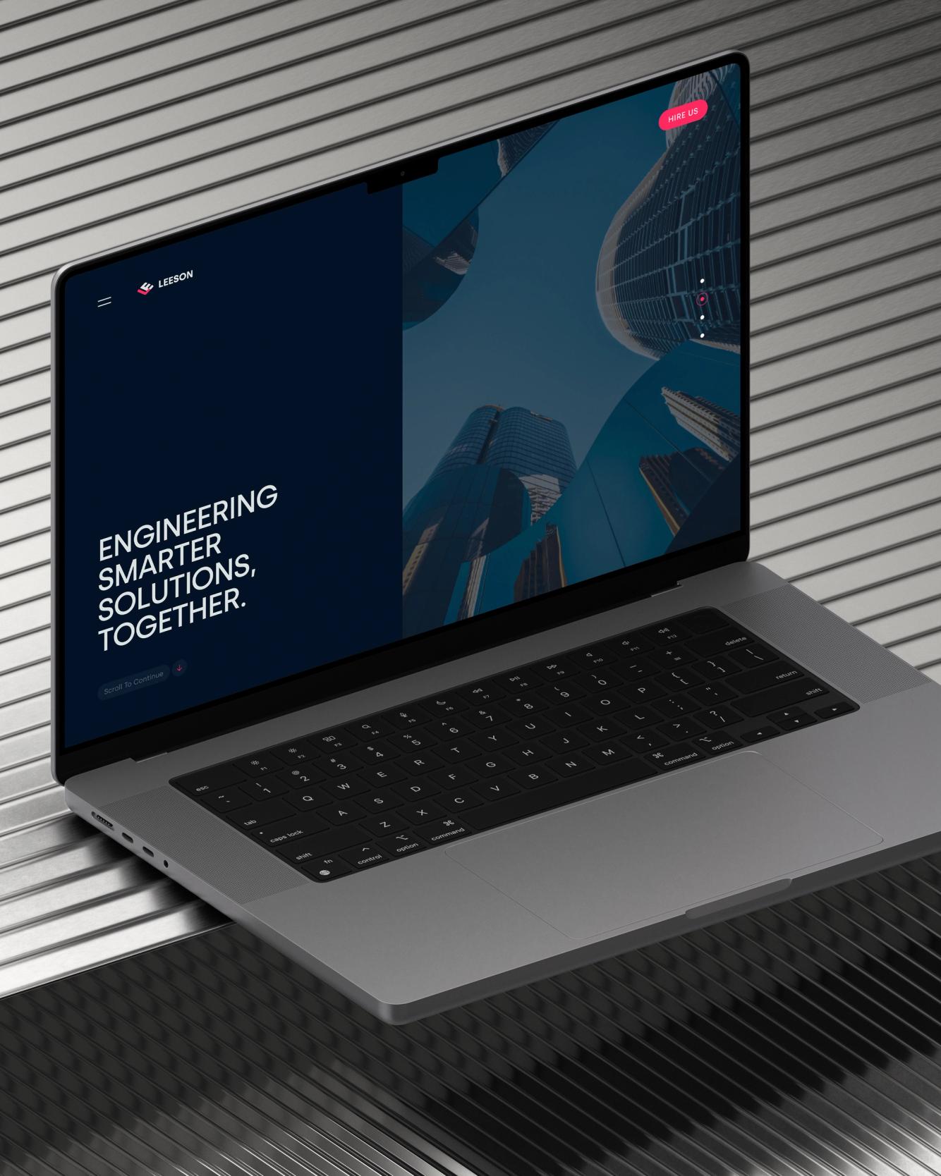 Modern website hero design on a MacBook Pro, featuring "Engineering Smarter Solutions Together" for Leeson.