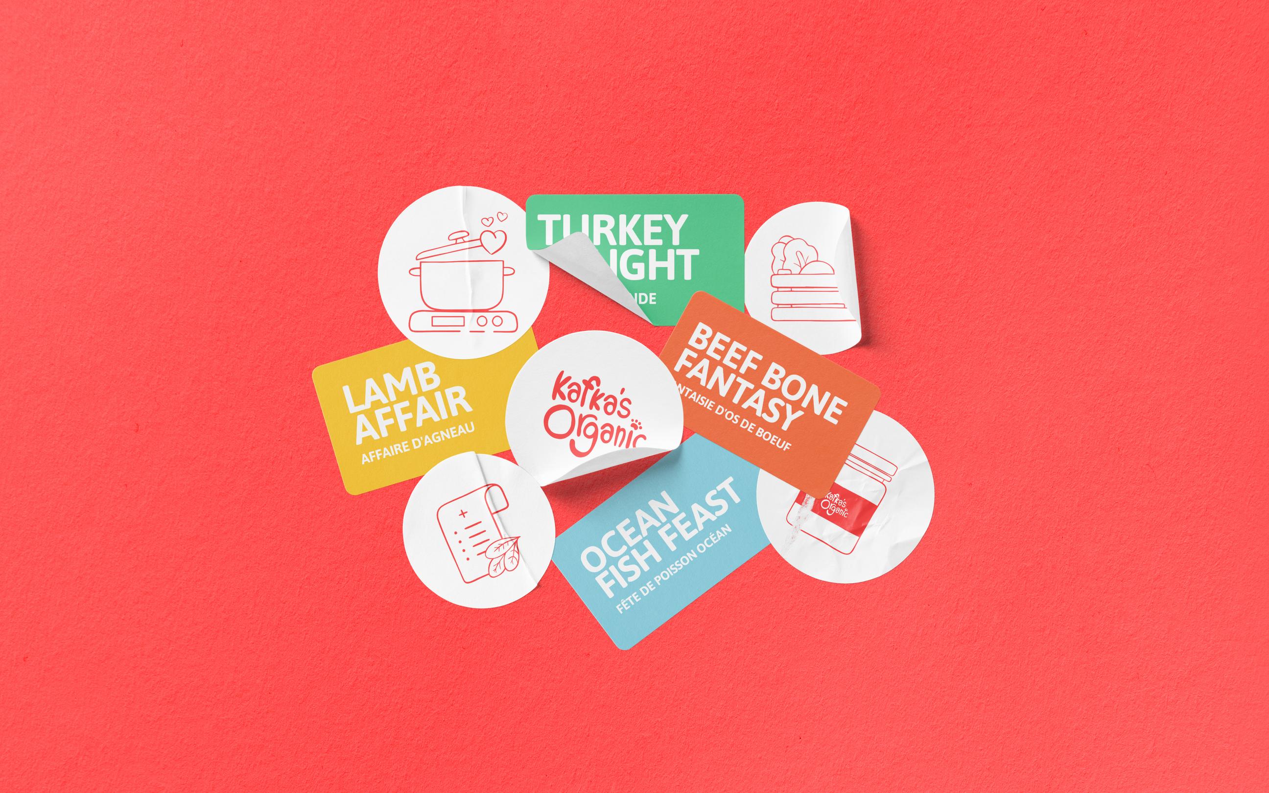 Kafka’s Organic food labels with colorful designs for products like lamb, turkey, beef, and ocean fish meals.