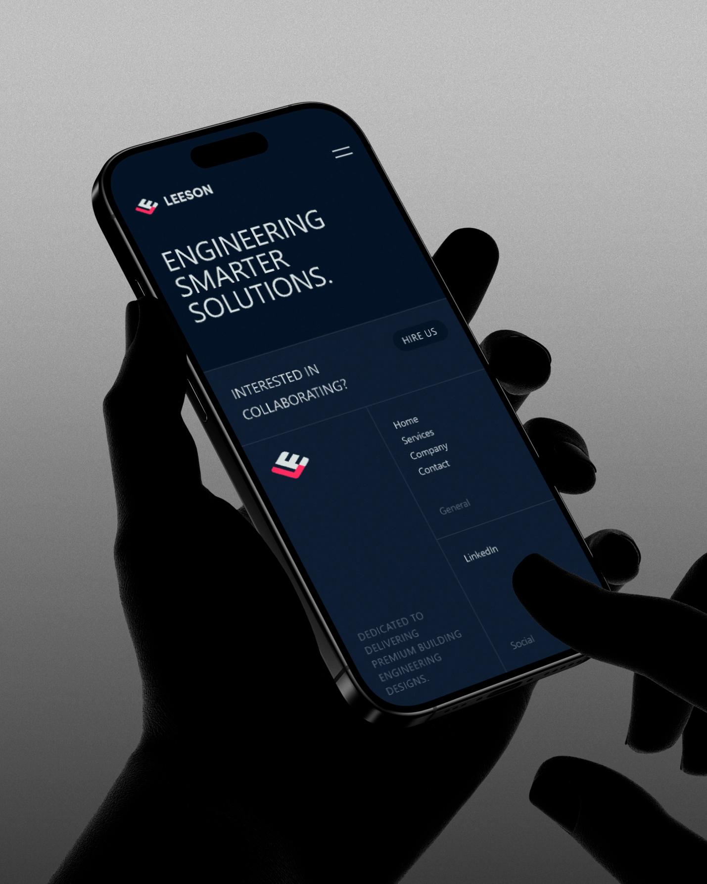 Mobile view of Leeson website showcasing engineering and design services with a sleek footer menu, emphasizing smart building solutions and collaboration opportunities.