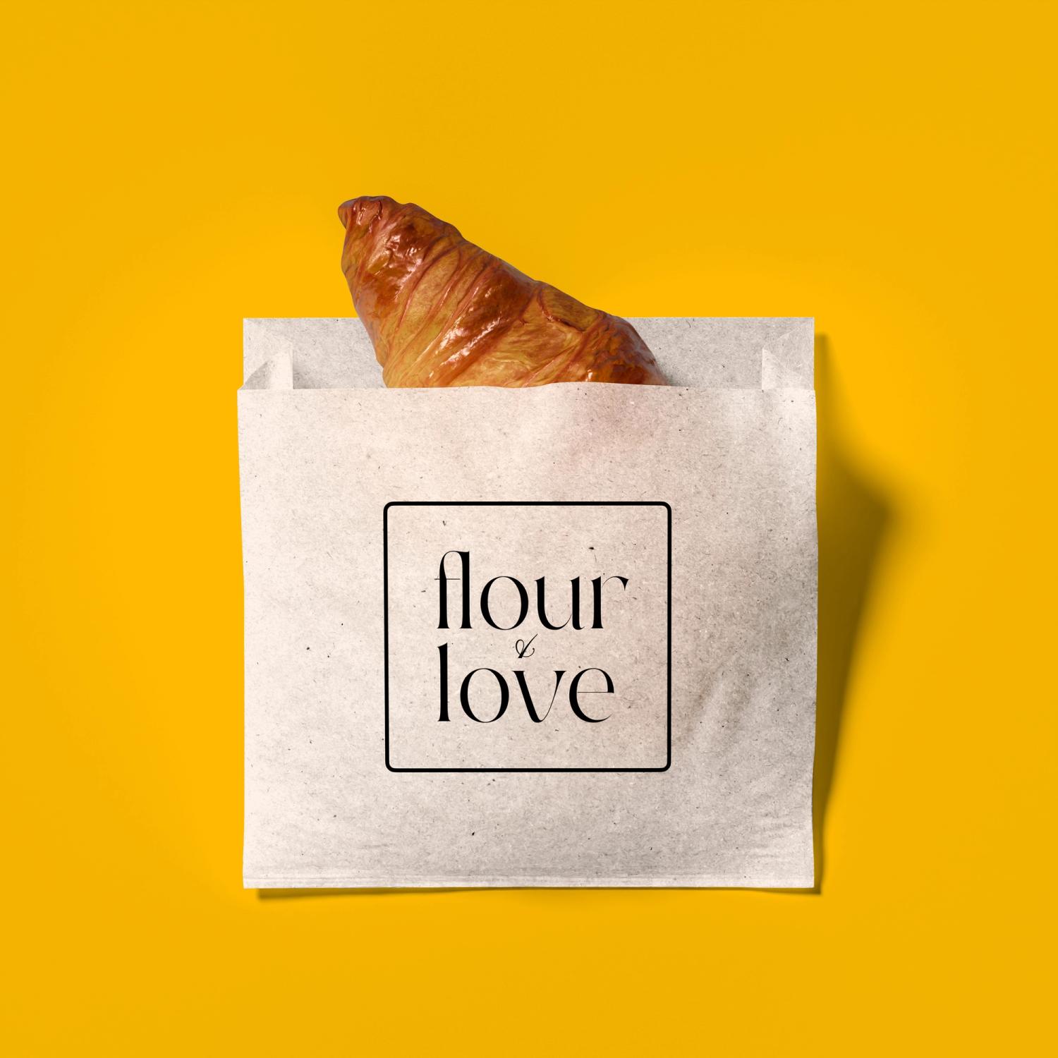 Croissant peeking out of a paper bag with "Flour & Love" branding in a minimalist design on a vibrant yellow background.