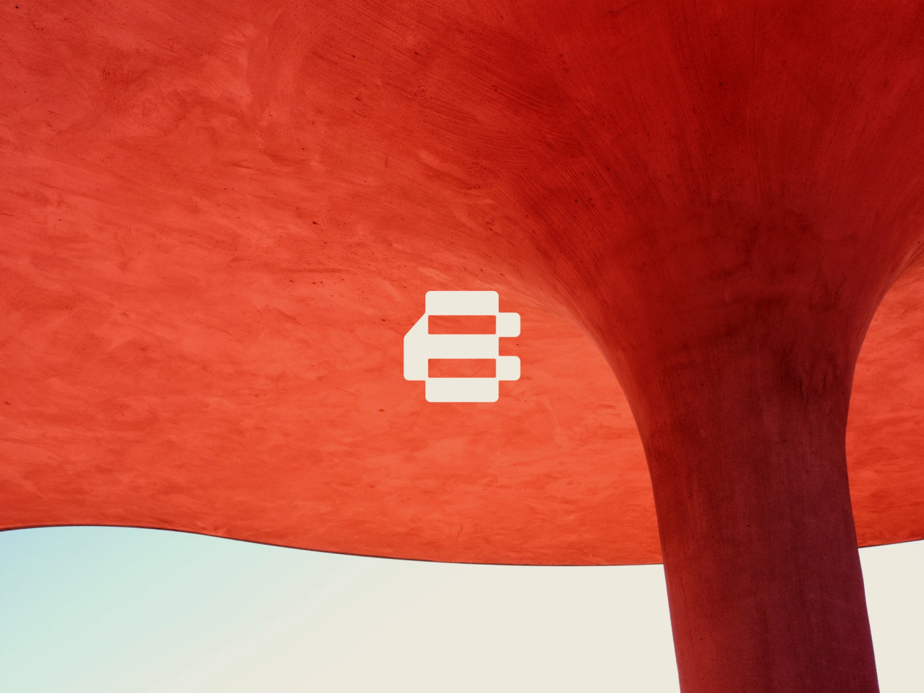 Modern logo design with abstract shape over vibrant red architectural background, showcasing creative branding.
