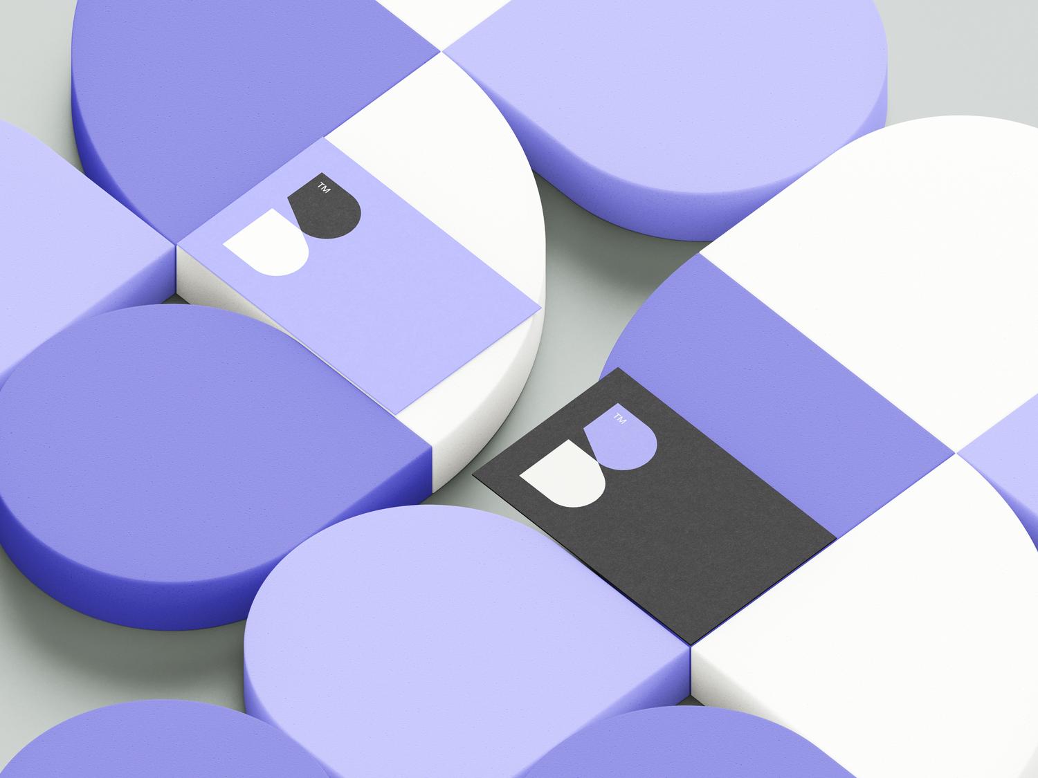 Creative branding design with purple and white geometric shapes and a modern business card featuring a minimalist 'B' logo.