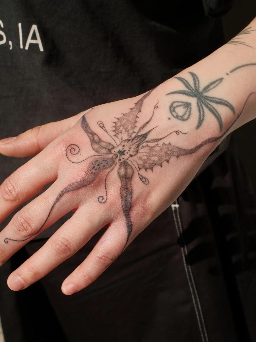 Moth flower, hand