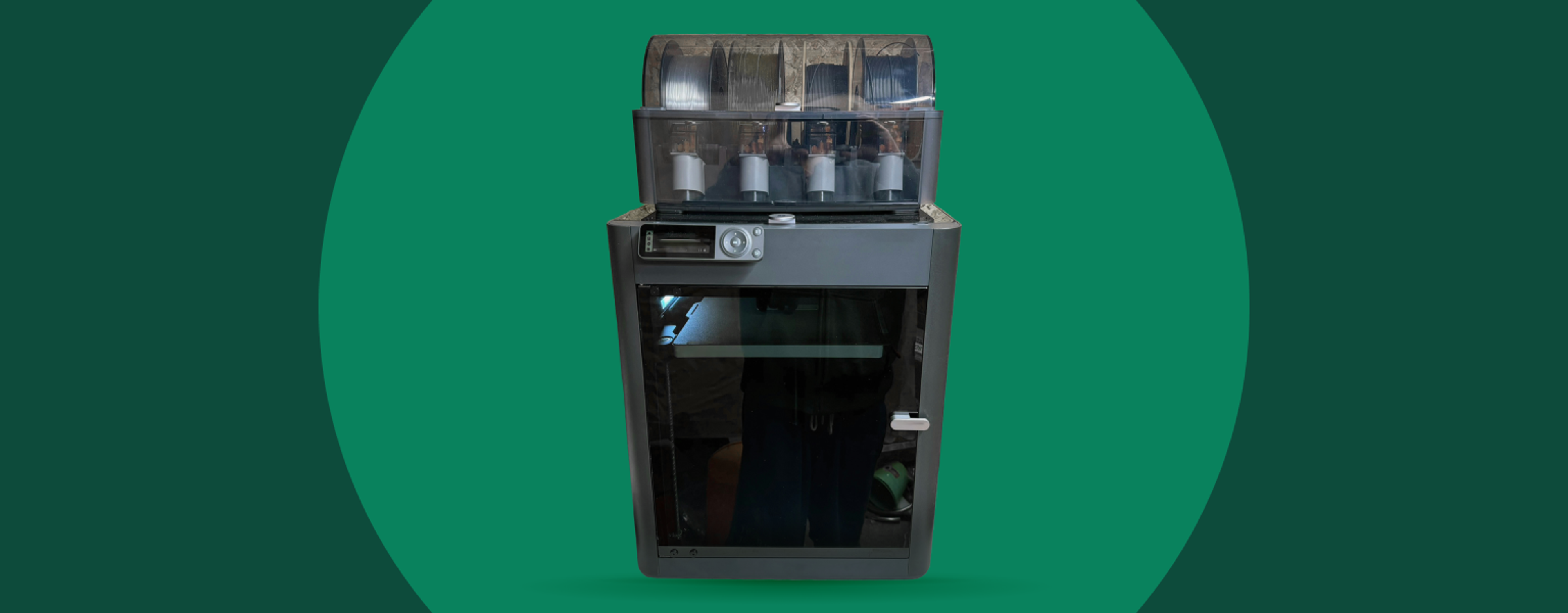 A 3D printer, standing with spools mounted on top, against a light green circle inside a darker-green background. Photo by Productivity Garden on Unsplash.