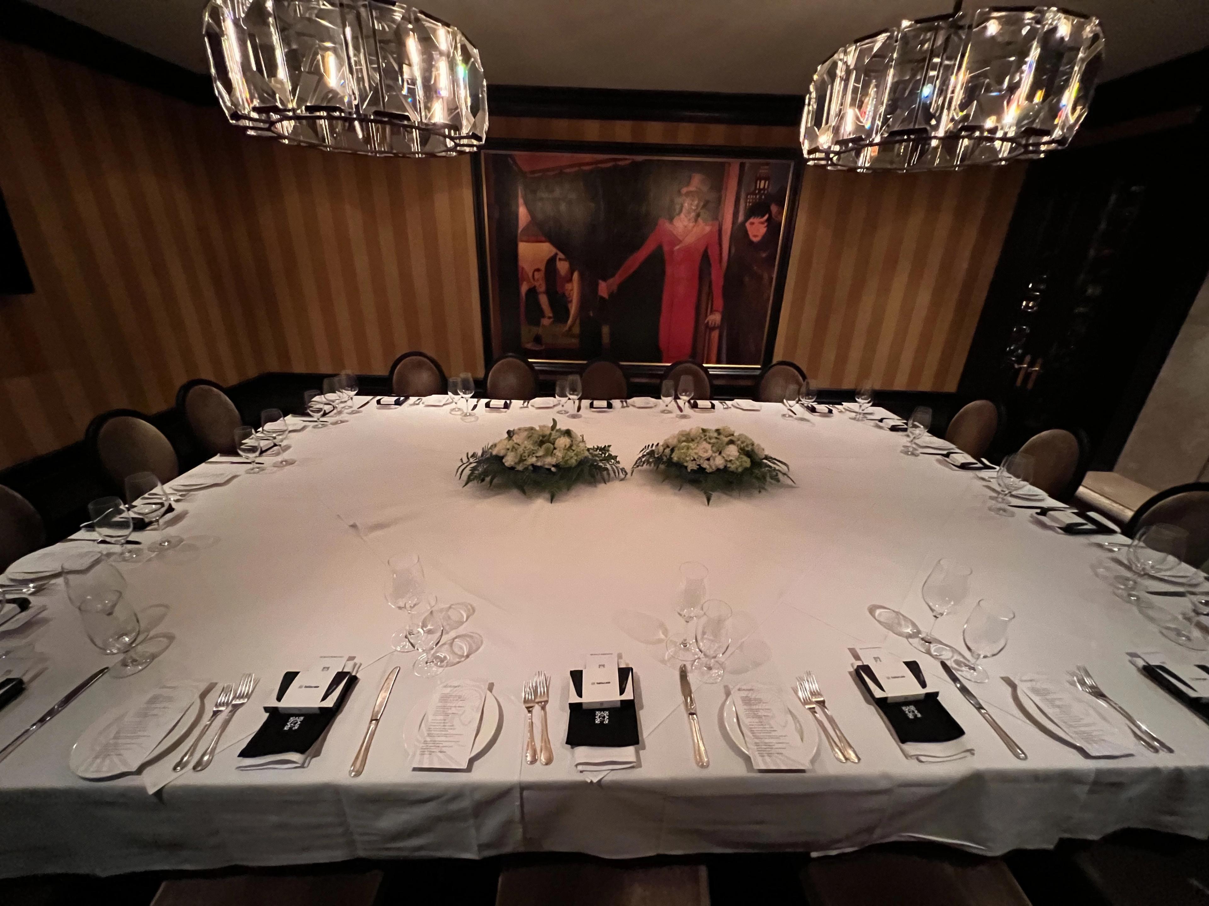 a dinner table set for VIP dinner at Gotham Steakhouse