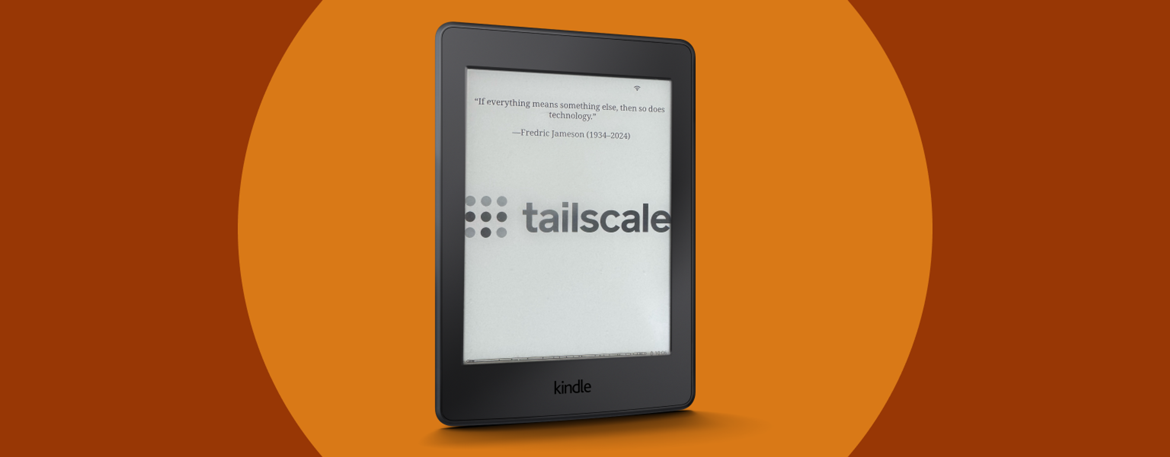 A Kindle, turned slightly sideways and positioned upright, with a prominent "Tailscale" logo/screensaver showing in the middle of its screen. At the top is a quote: "If everything means something else, then so does technology."—Fredric Jameson, (1934-2024)