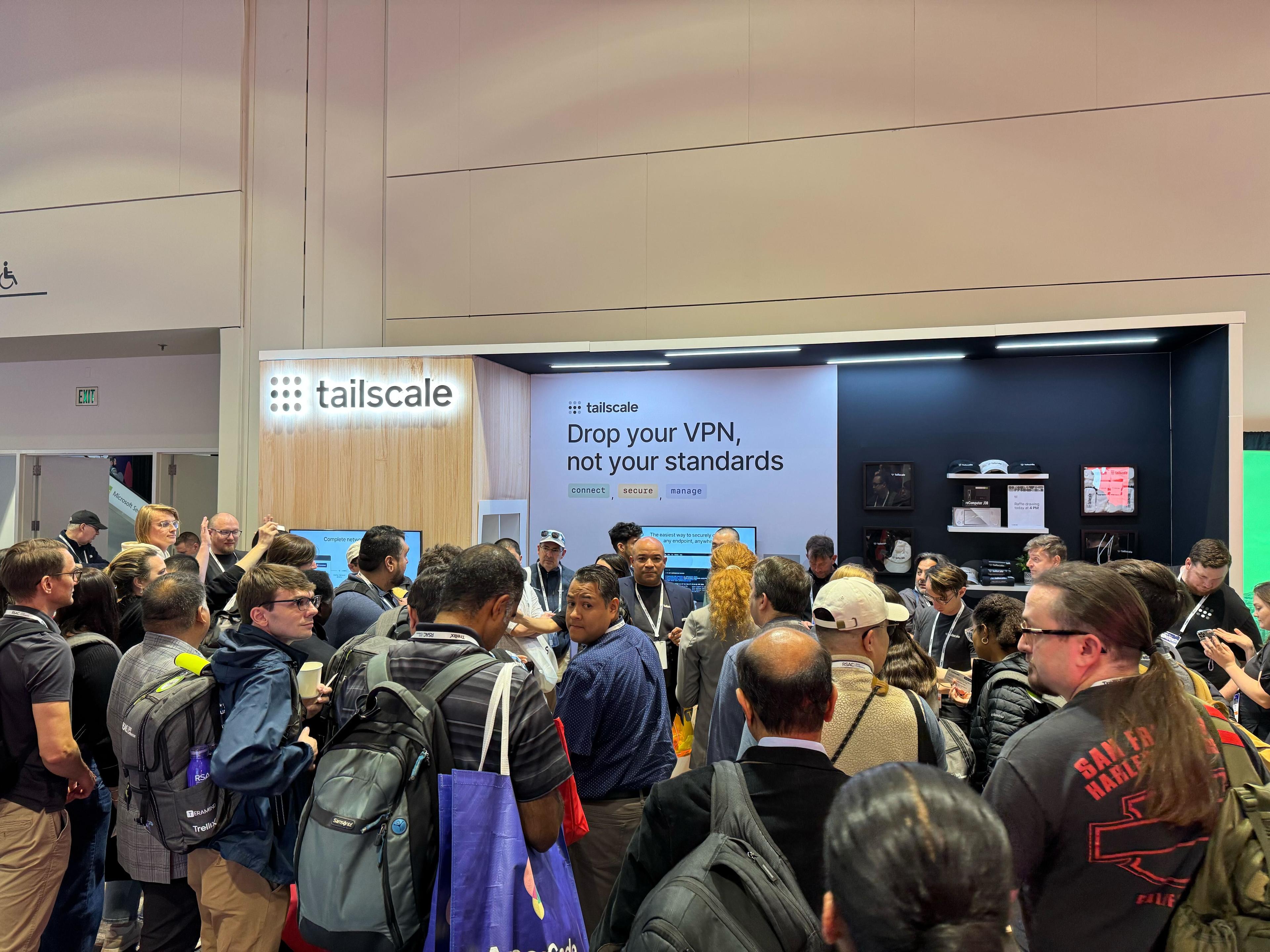 Attendees visting the Tailscale booth