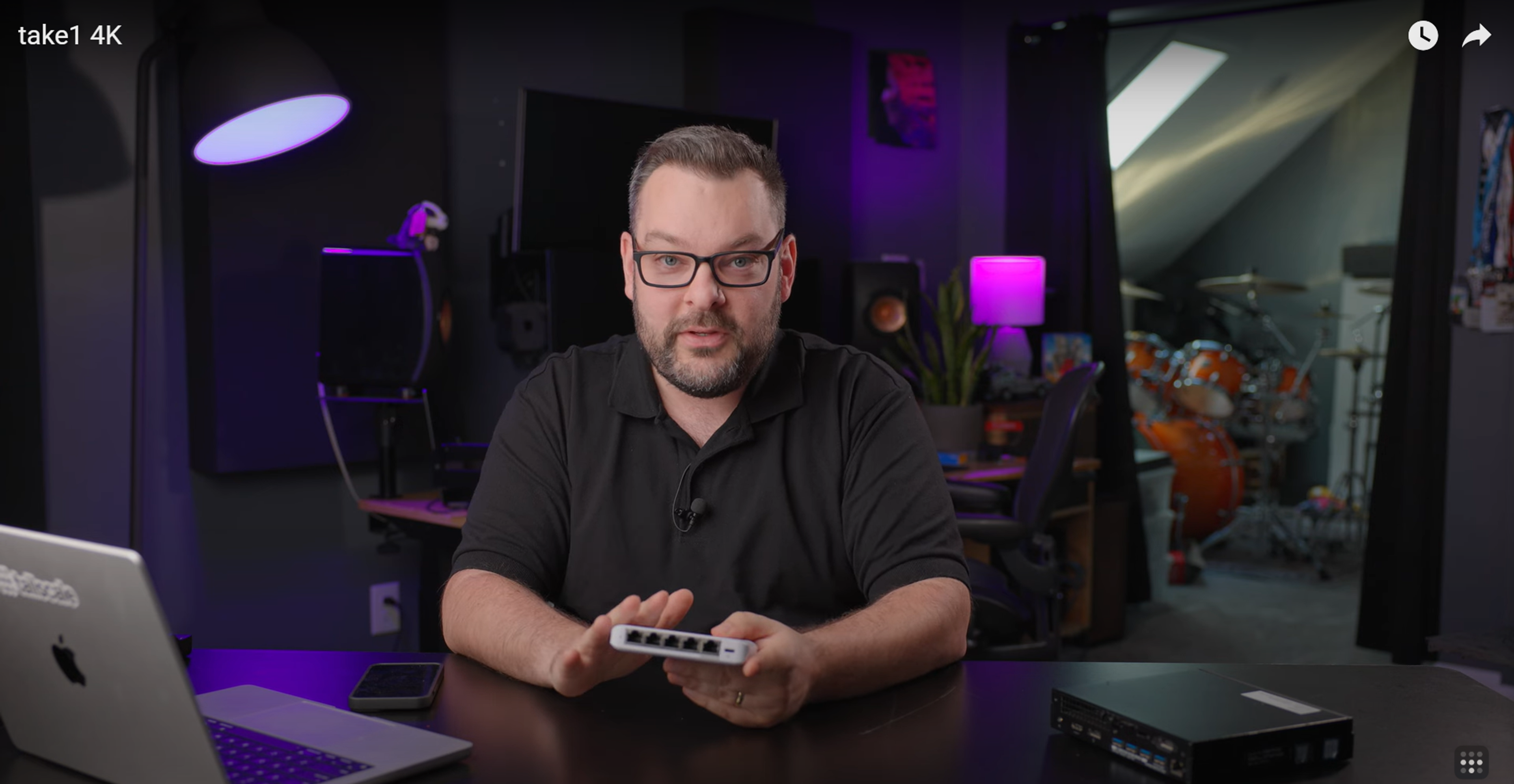 Alex holding a Ubiquiti switch