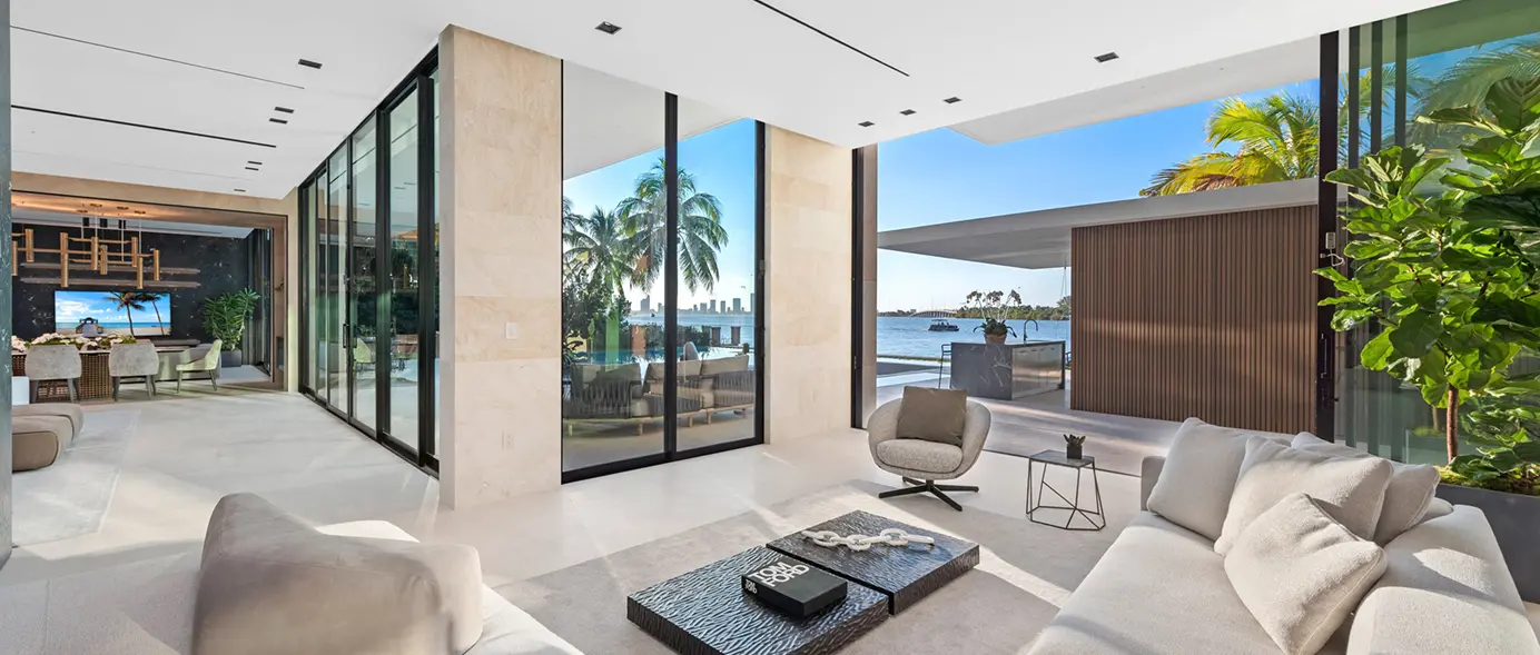 Convertible indoor-outdoor patio living room opening fully to bay views.