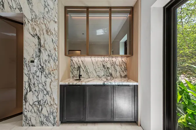 Striking bar console clad in bold black-and-white zebra-patterned marble.