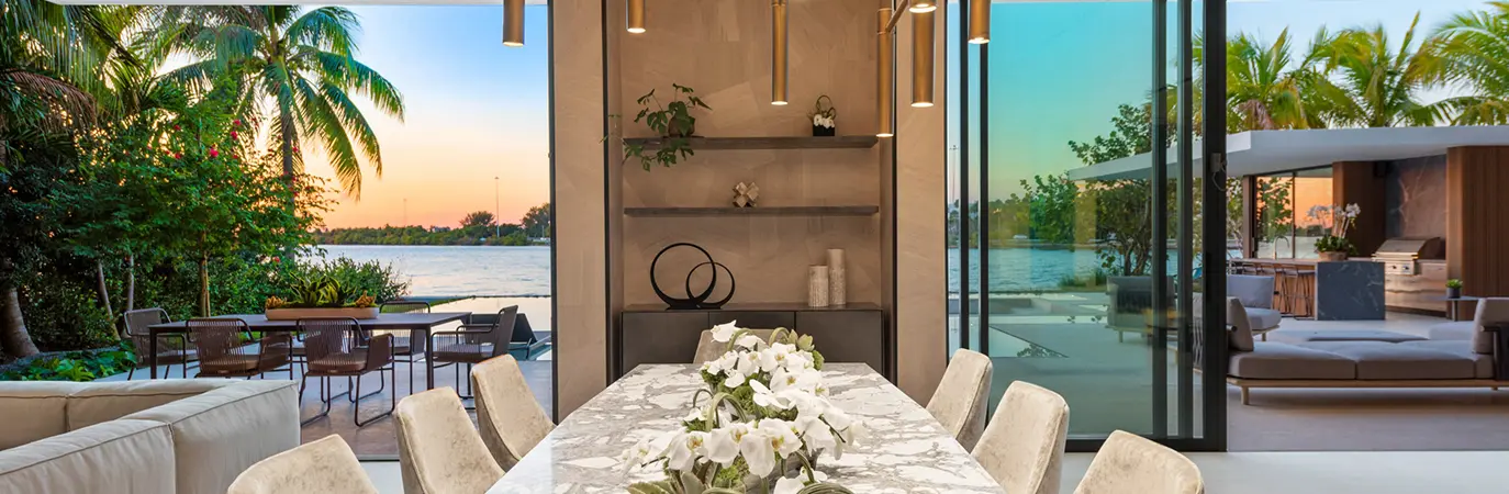 View of luxurious ocean front view from dining room of waterfront Miami home.