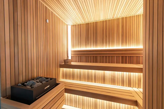 Multi-level bathhouse featuring a tiered steam room and sauna for ultimate relaxation.