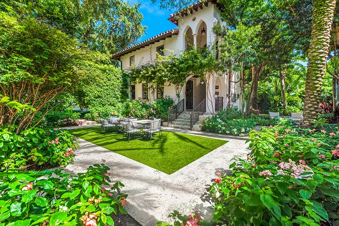 Garden view of the central courtyard, showcasing manicured landscaping and classic architecture.