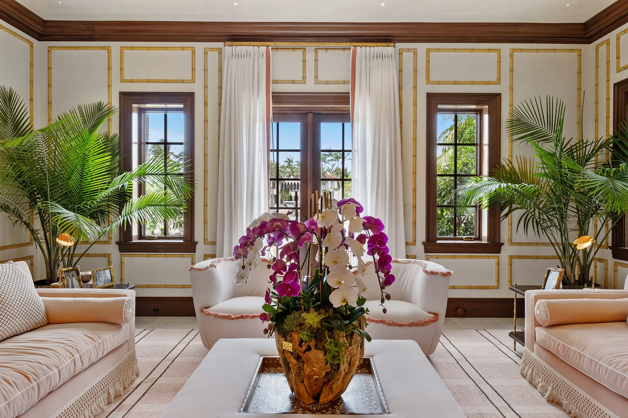Luxury sitting room with custom furnishings and tropical accents.