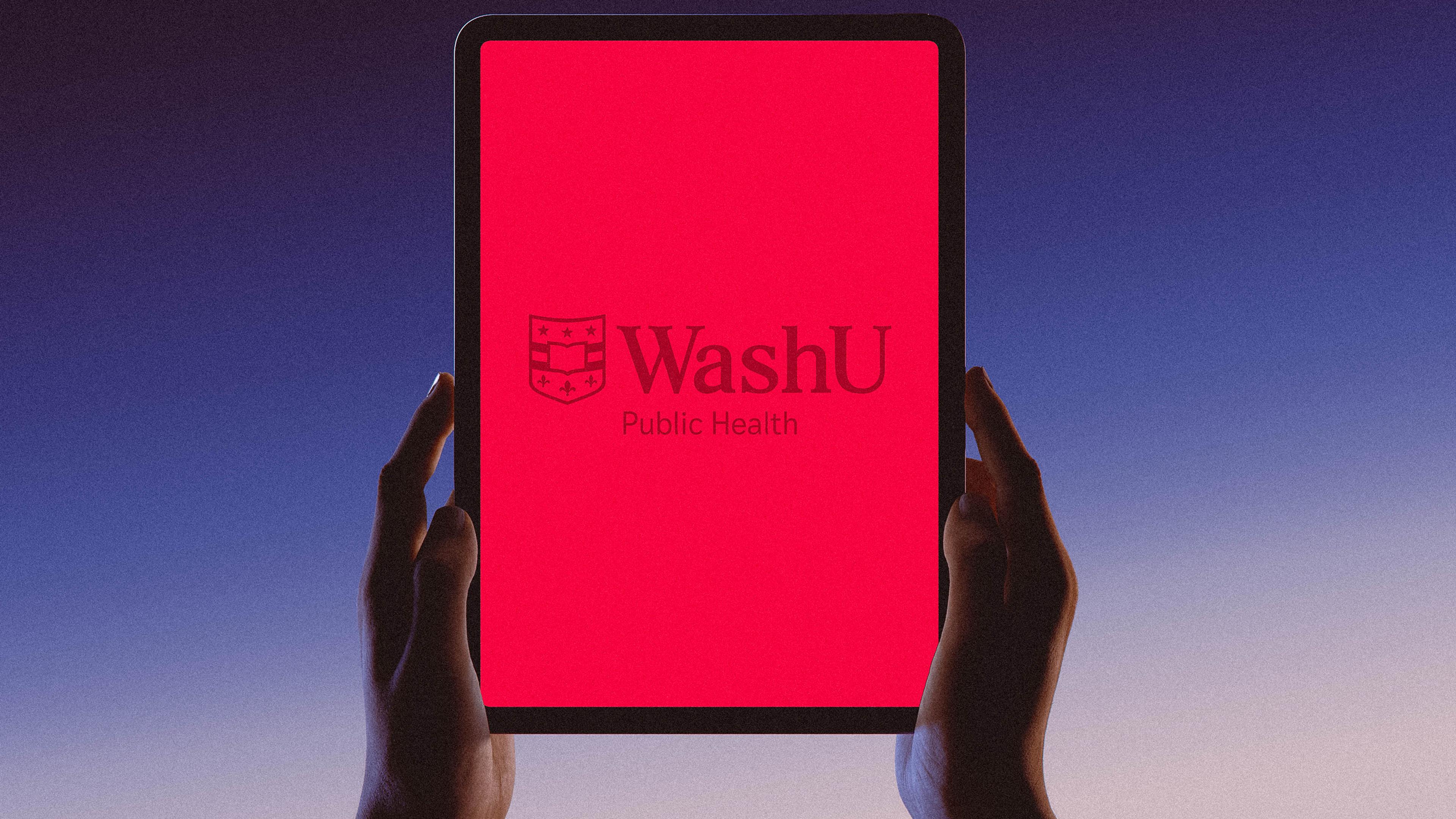 Hands holding an iPad that is displaying the WashU logo