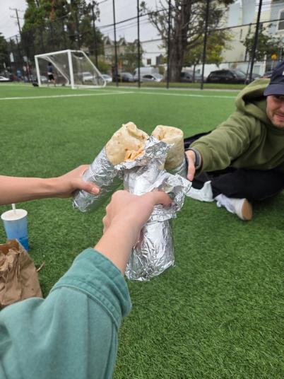 3 people with burritos doing a burrito cheers