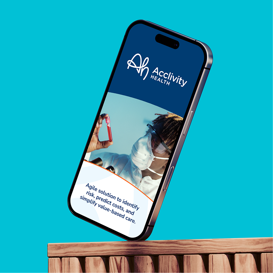 The Acclivity Health site on a phone propped on a wooden ledge