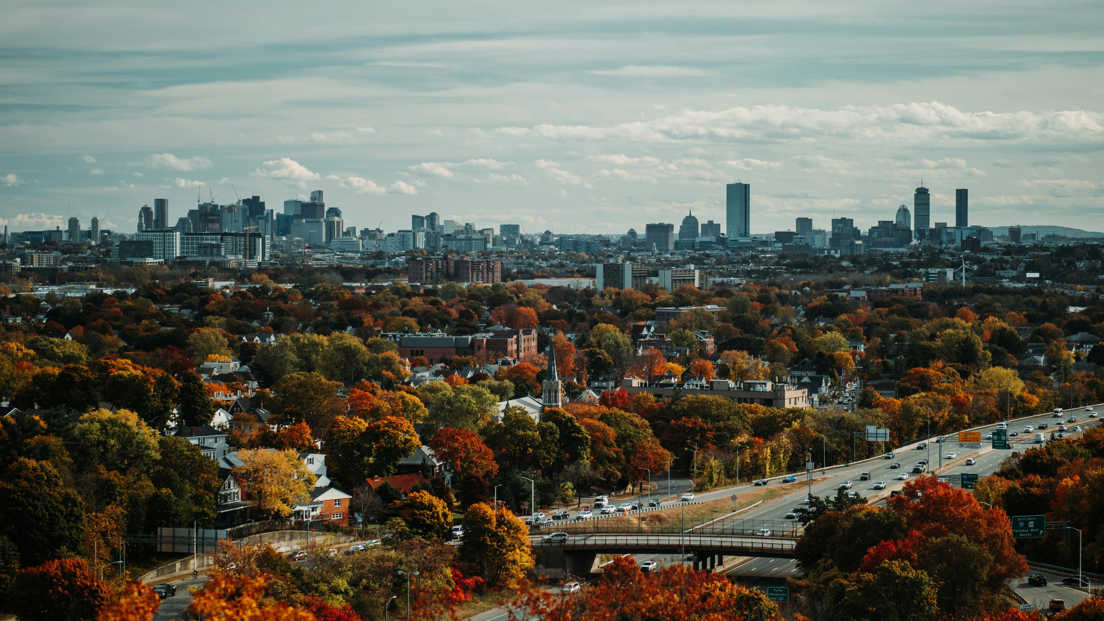The Boston skyline in autumn, seen across fall foliage