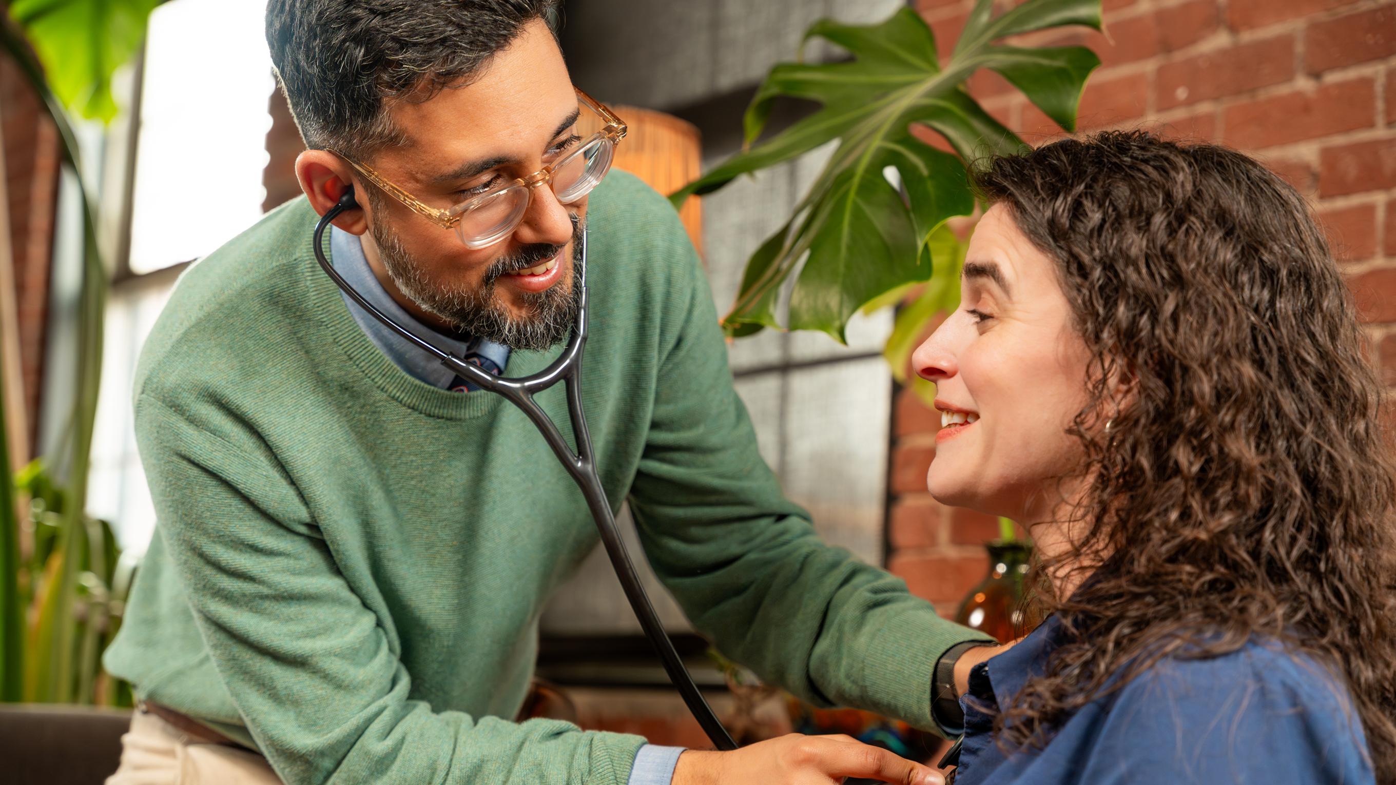 Doctor listening to a patient's heart with a stethoscope