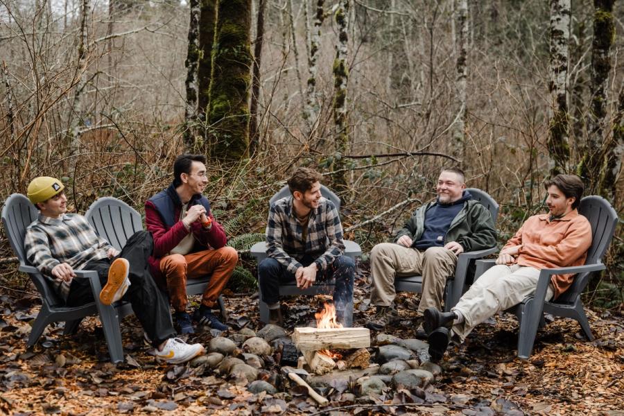 The team around a fire pit