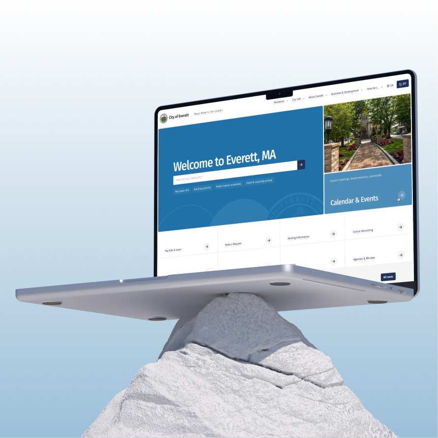 The City of Everett site on a laptop balanced on a white rock peak