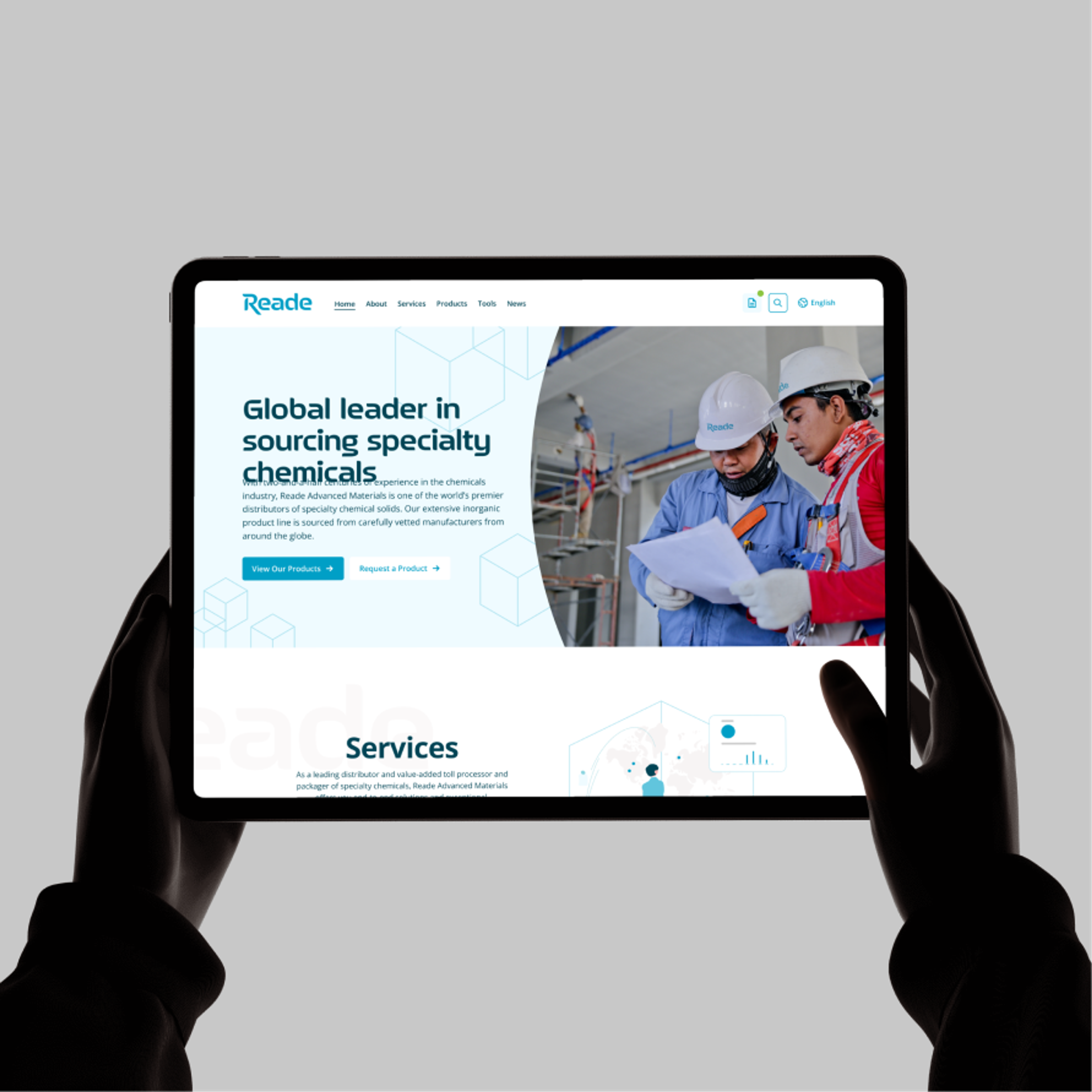 Hands holding a tablet showing the Reade Advanced Materials site