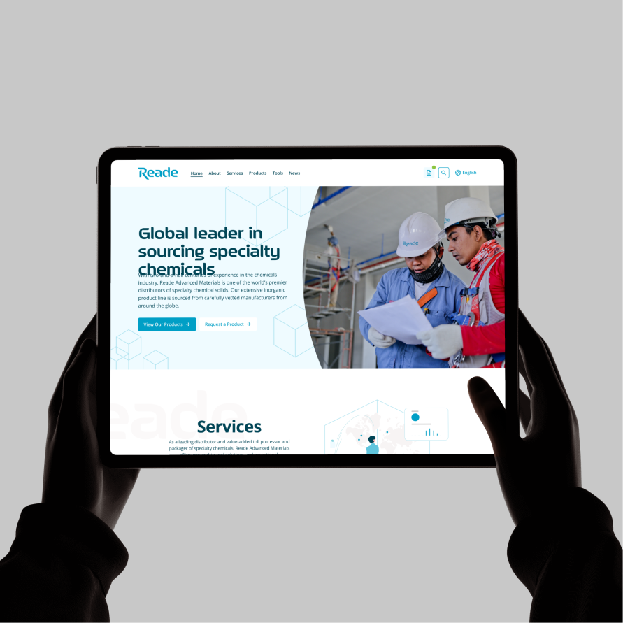 Hands holding a tablet showing the Reade Advanced Materials site