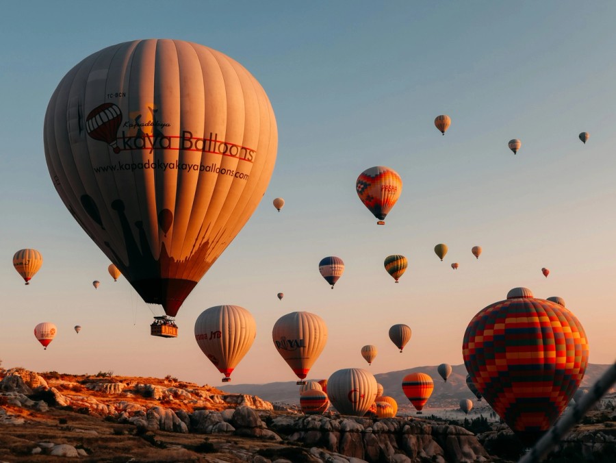 Hot air balloons on brown field during daytime