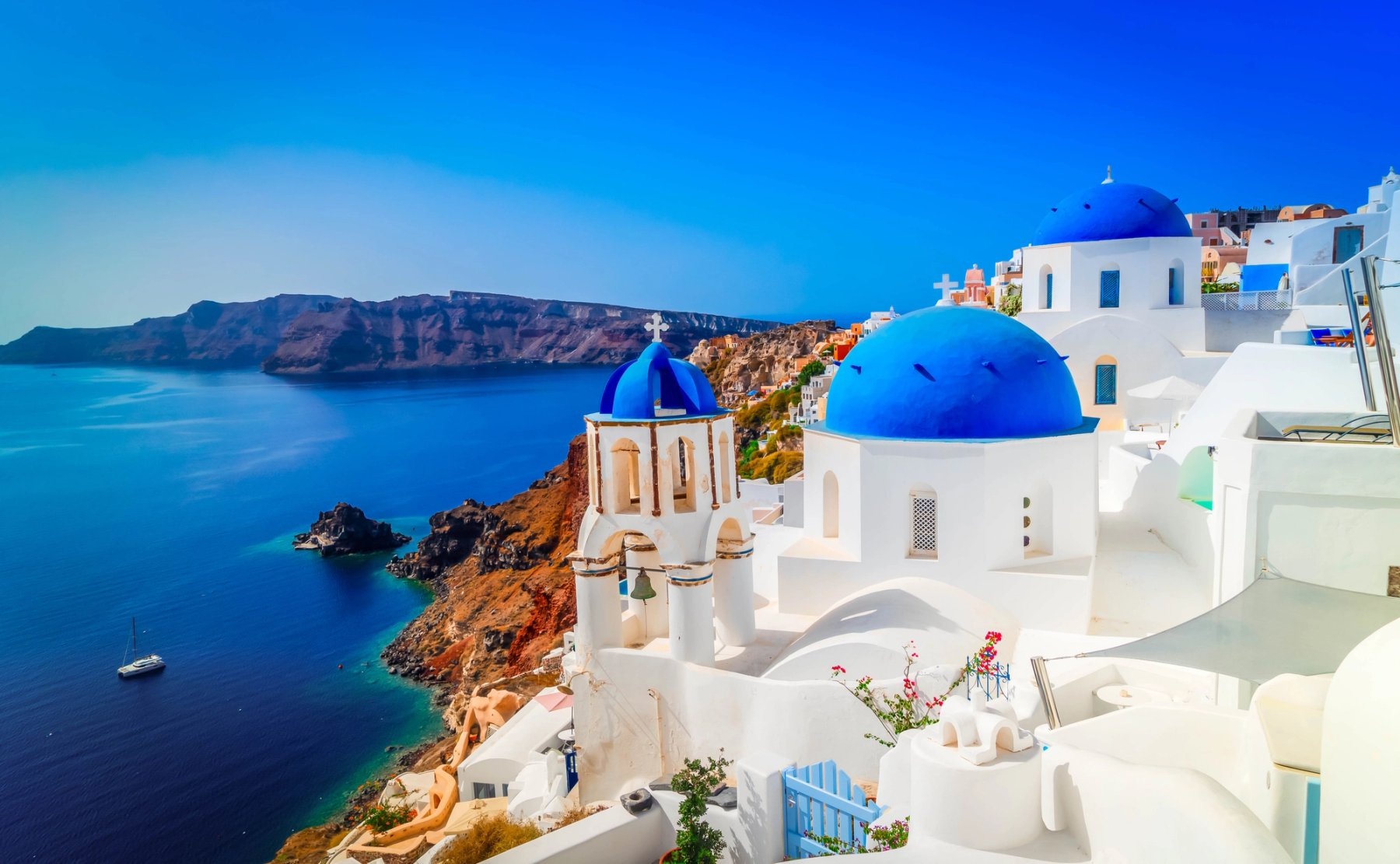 The blue domes and sea of Santorini, Greece