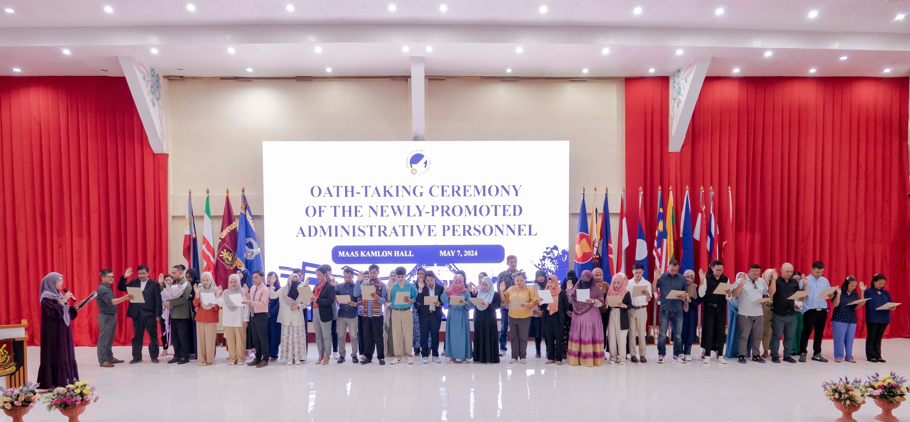 26 newly-hired and promoted employees take their oath