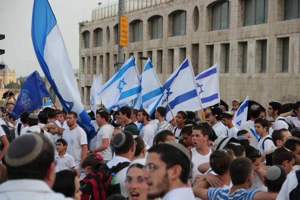 A march carrying Israeli flags
